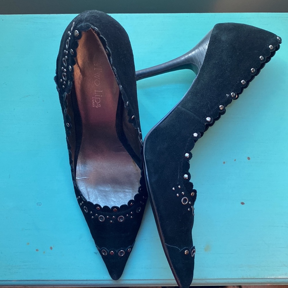 Suede Two Lips “Chassity” stilettos with stylish metallic adornments.